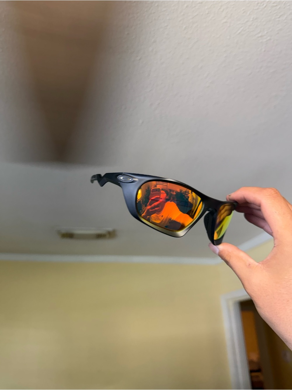 Oakley Men's Black Frame Sunglasses with Orange Mirrored Lenses